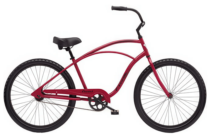 Red cruiser bicycle with black tires on a white background.